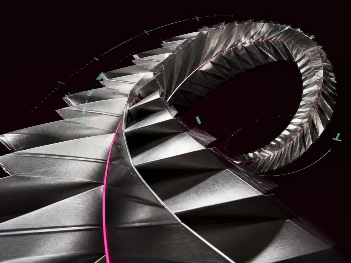 Folded silver ribbon looping through a dark field with magenta and aqua traces